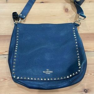 Navy blue Valentino studded cross body bag.  Small signs of wear.  See picture.